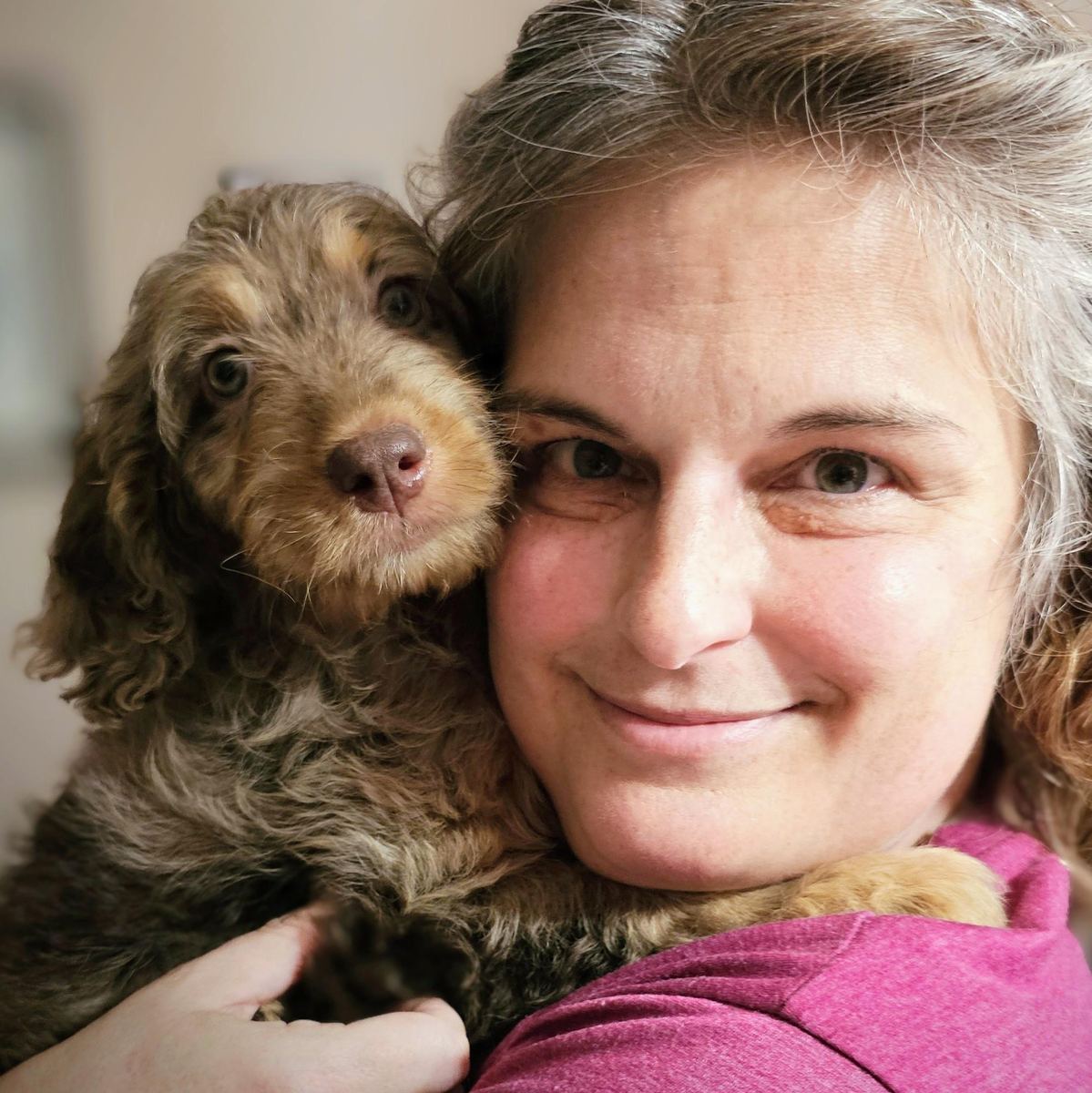 Liz with her doodle puppy, Hazel